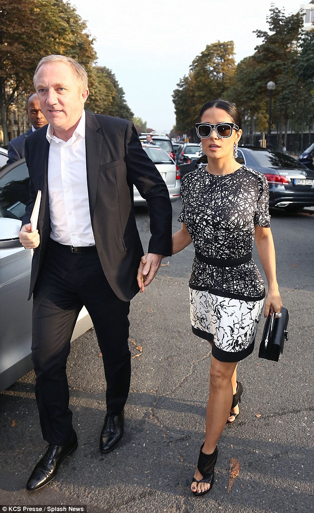 FranÁois-Henri Pinault and Salma Hayek arrive at Balenciaga Paris Fashion Week Spring/Summer 2014